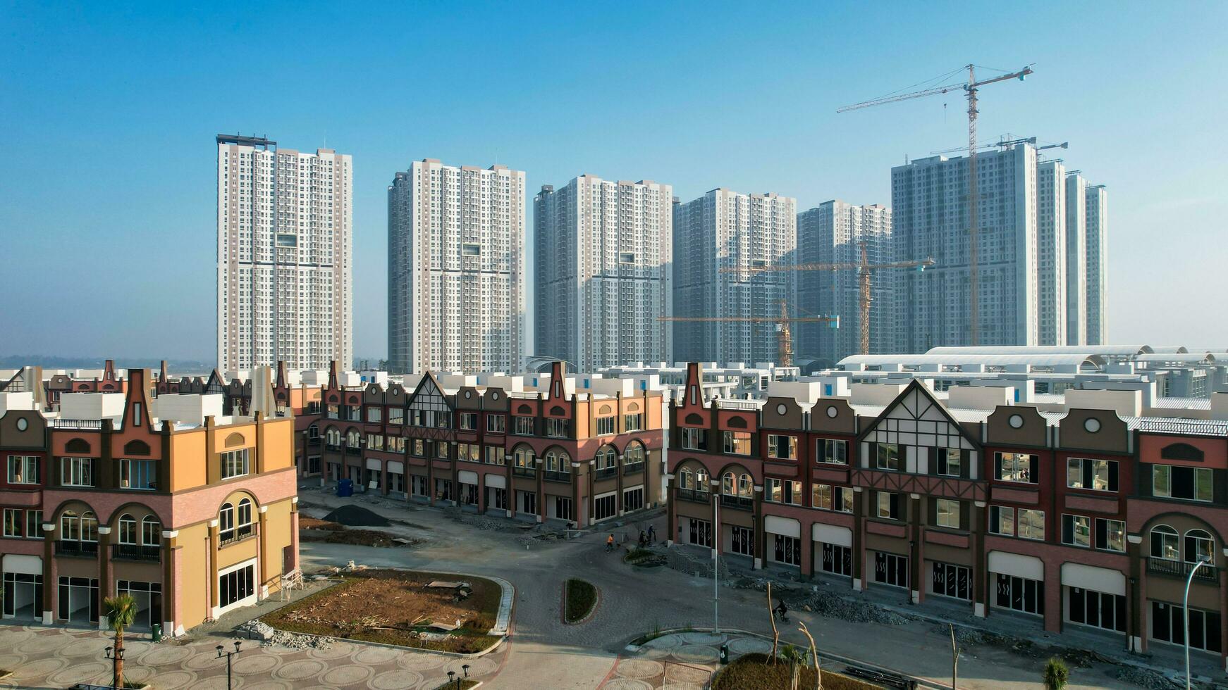 Aerial view of Amsterdam Dutch dancing houses above the southeast of the jakarta river in the spring landscape of the old European city at Pantai Indah Kapuk. Jakarta, Indonesia, June 23, 2022 photo