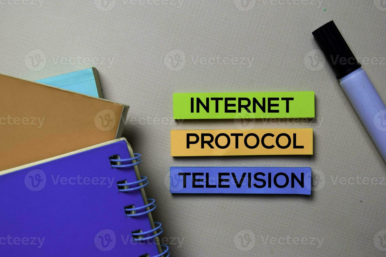 Internet Protocol Television - IPTV text on sticky notes isolated on office desk photo