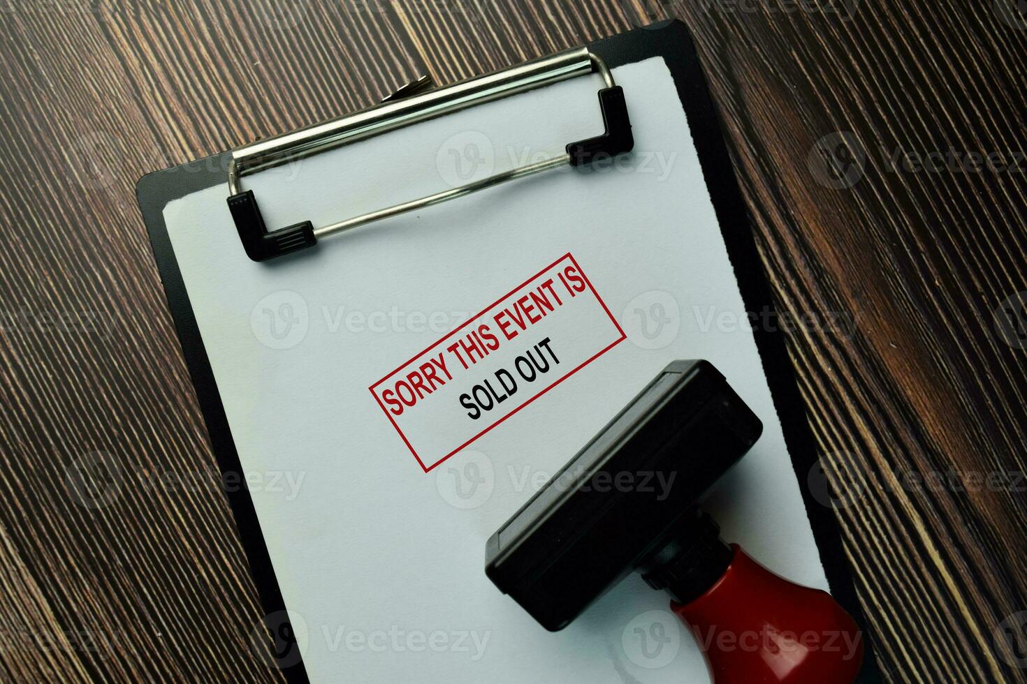 Sorry This Event Is Sold Out write on a book isolated on Wooden Table. photo