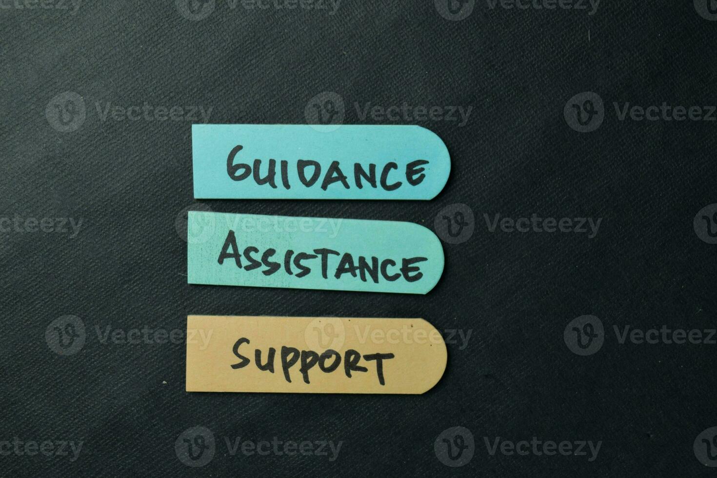 Guidance, Assistance, Support write on sticky notes isolated on office desk. photo