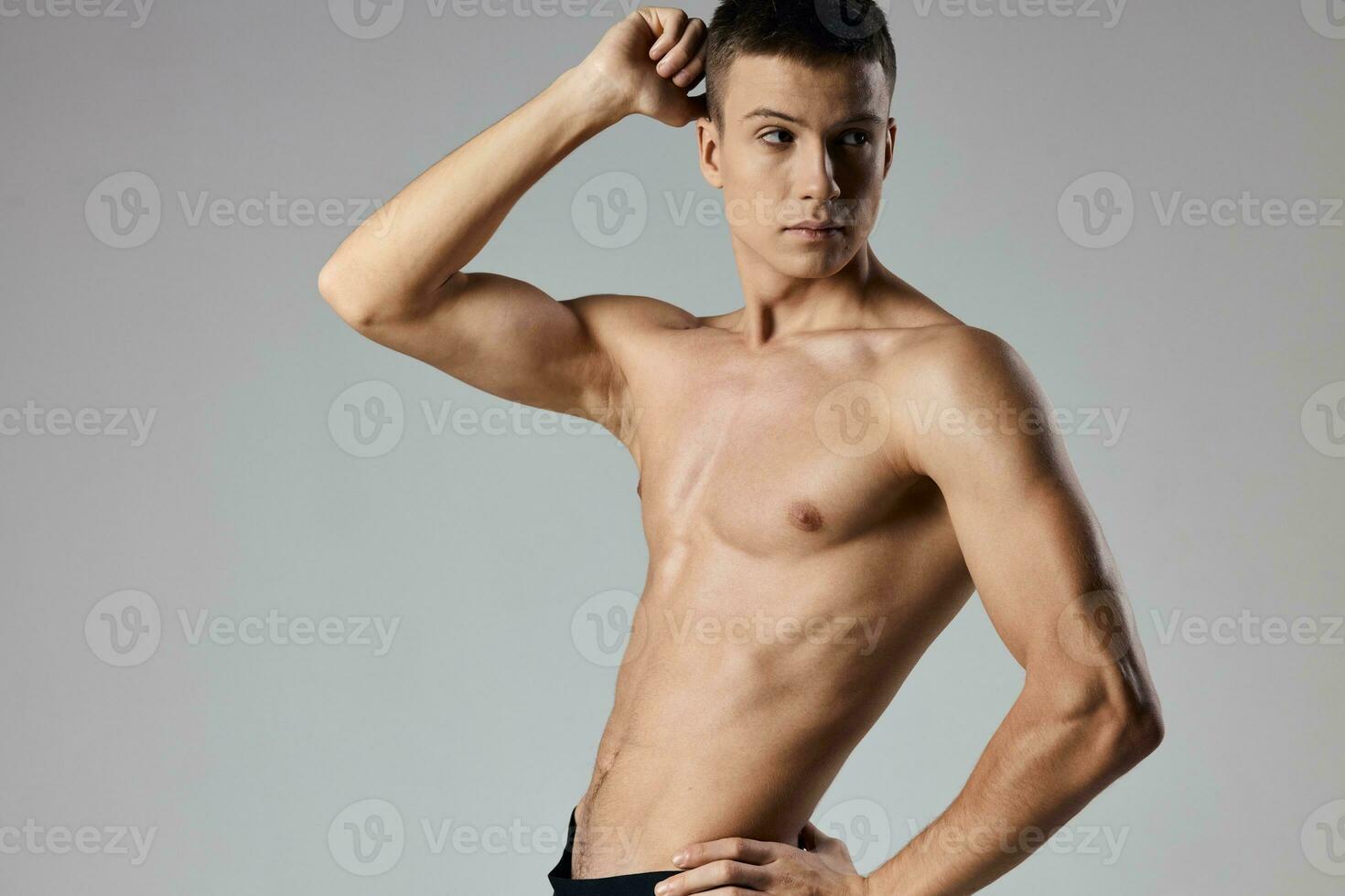 sexy athletes with pumped up arm muscles on gray background cropped view photo