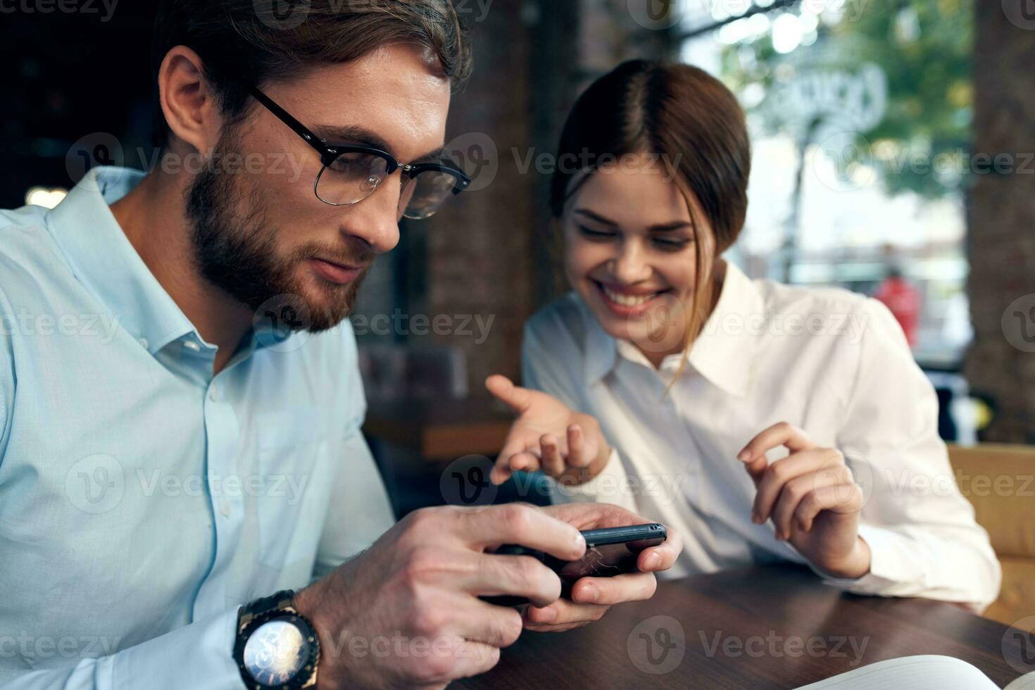 business man and woman in cafe breakfast leisure communication technology photo
