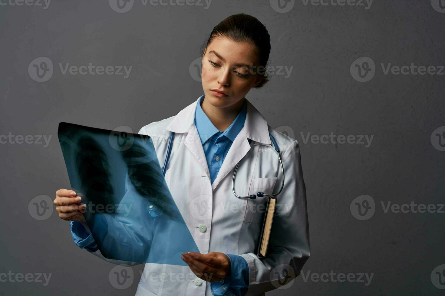 female doctor white coat medicine examination dark background photo