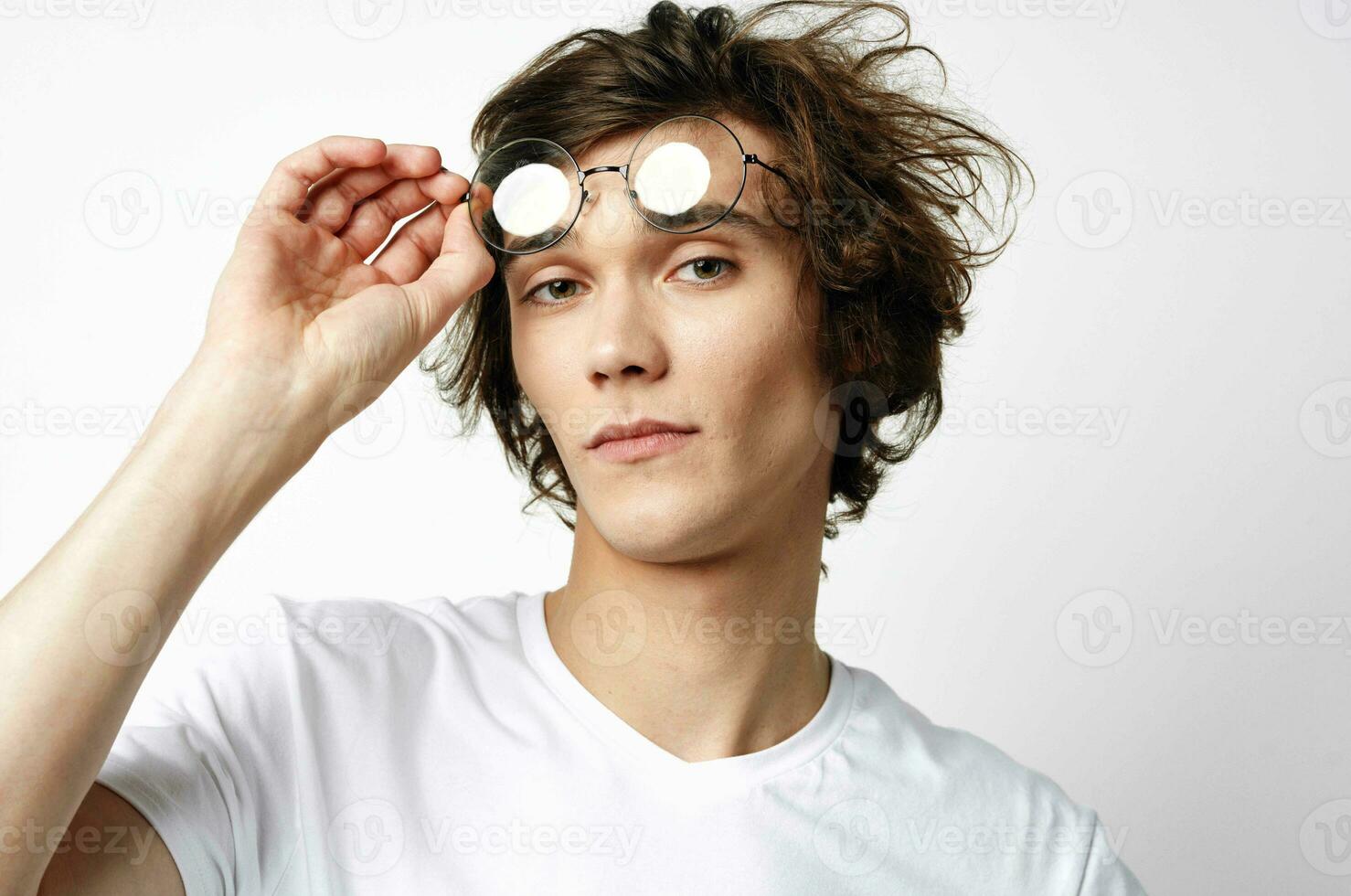 teenager in white t-shirt pimples on the face skin problems studio photo