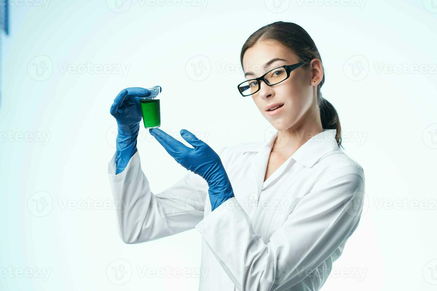 laboratory assistant in white coat chemical solution analyzes professional science photo