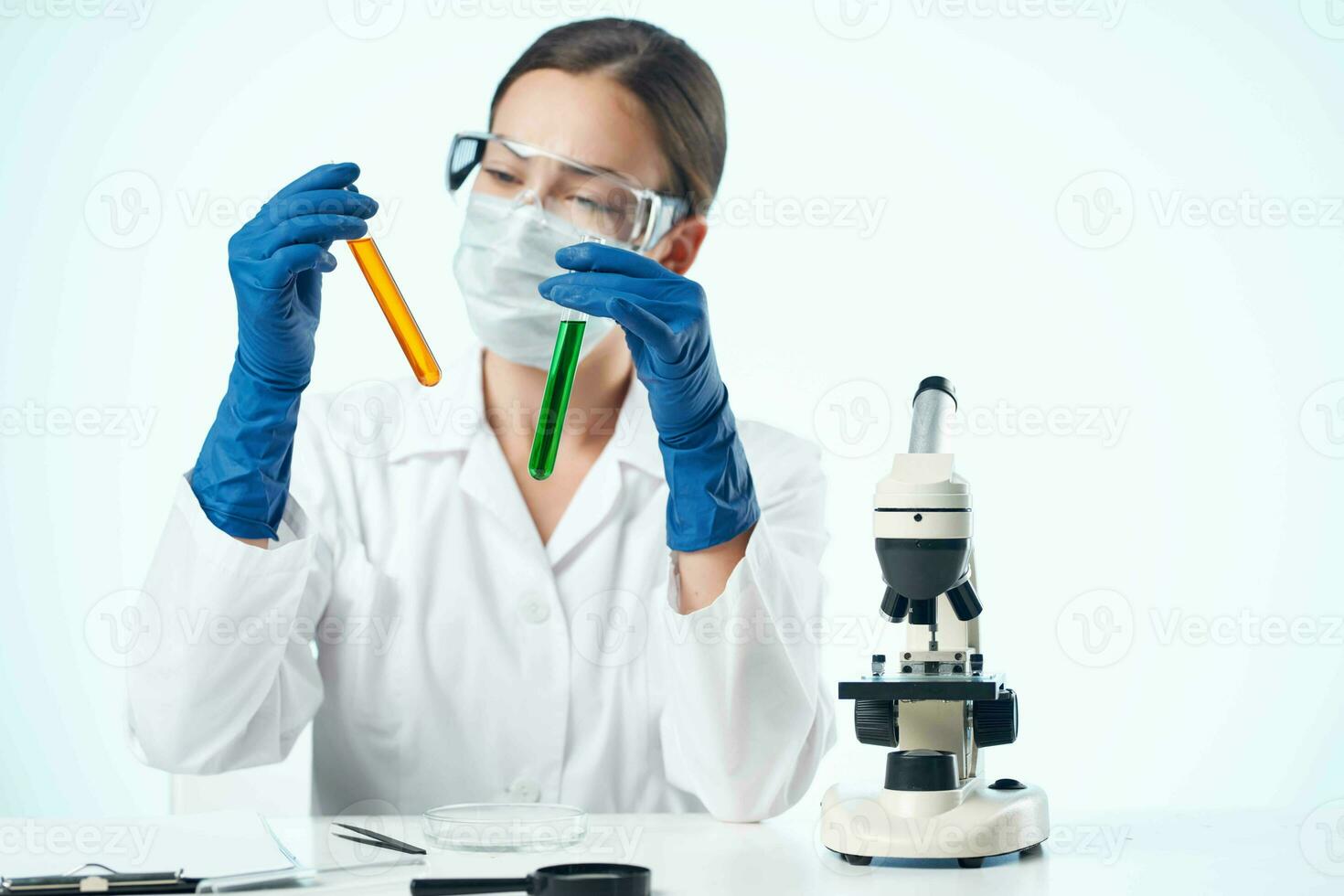 female laboratory assistant wearing yellow glasses chemical solution microscope research biotechnology photo