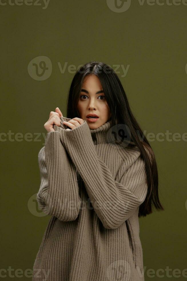 young woman in a sweater posing smile clothing fashion isolated background photo