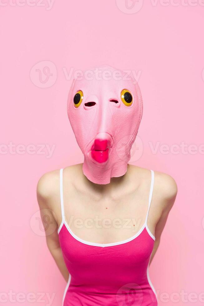 Crazy woman in pink fish head costume poses on pink studio background,  provocative Halloween costume 23662241 Stock Photo at Vecteezy