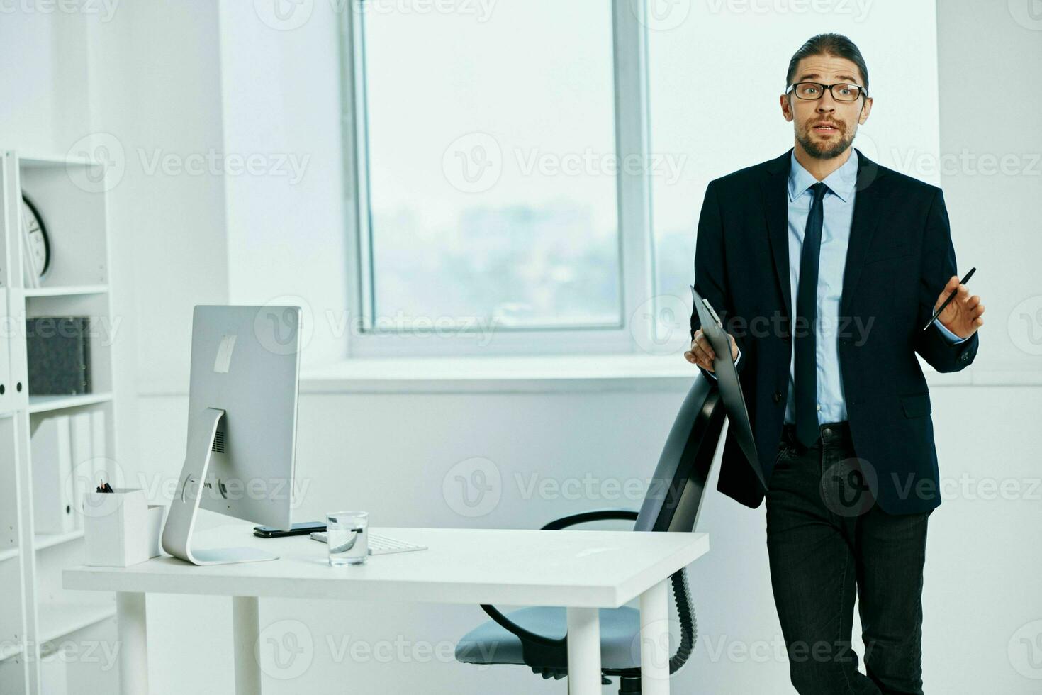 office worker in the office gestures with his hands executive photo