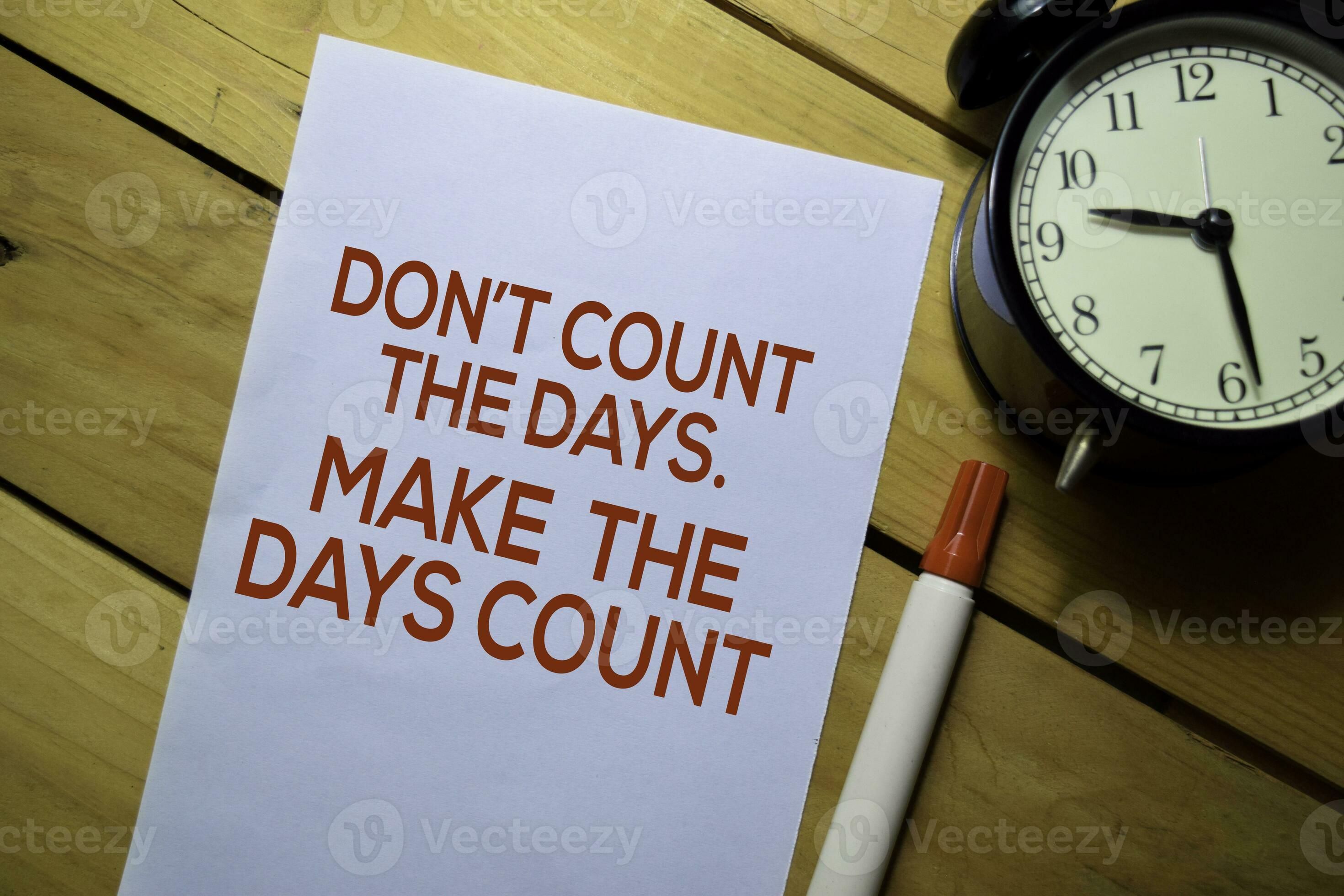 Don't Count The Days. Make The Days Count text on the paper isolated on