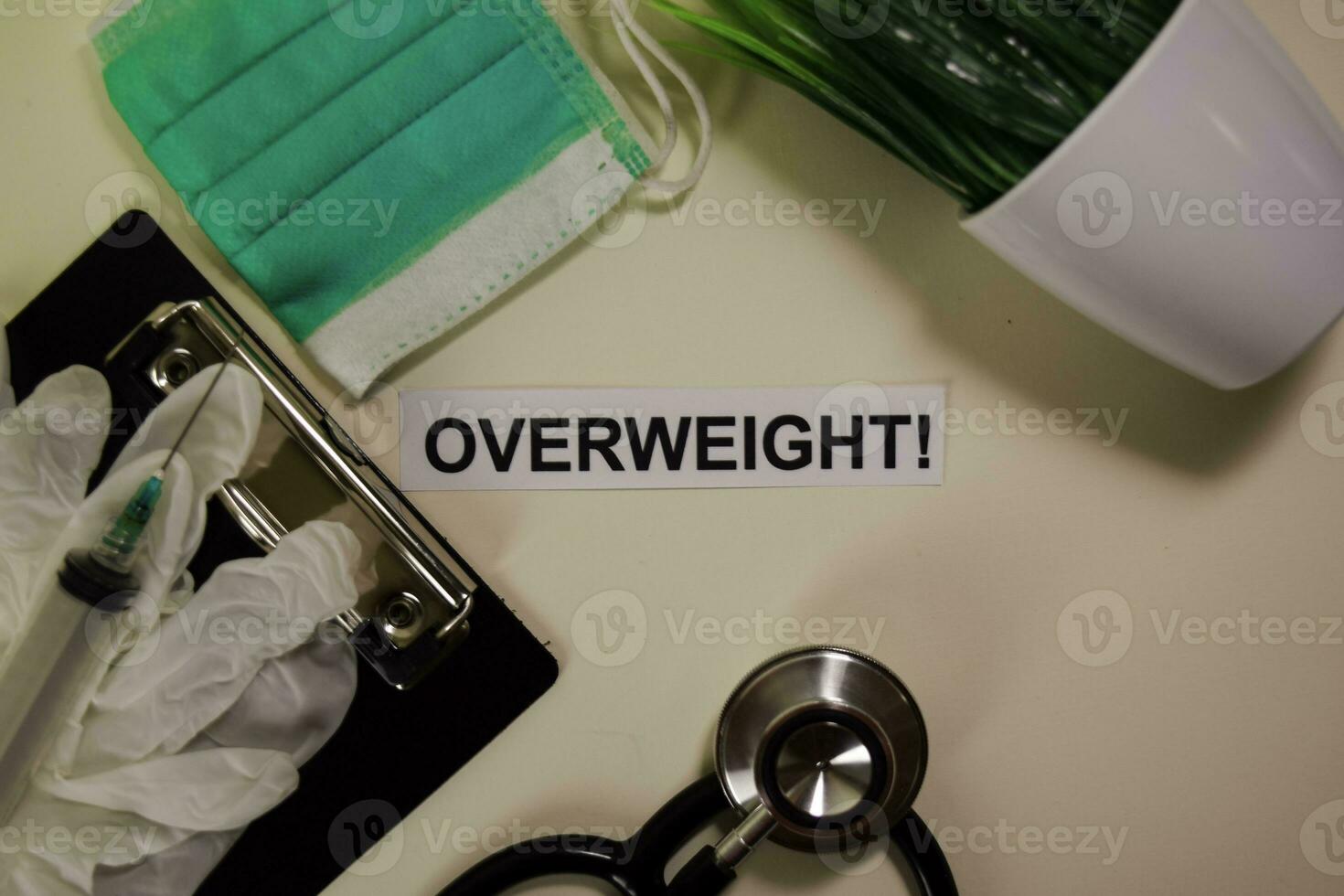 Overweight with inspiration and healthcare medical concept on desk background photo