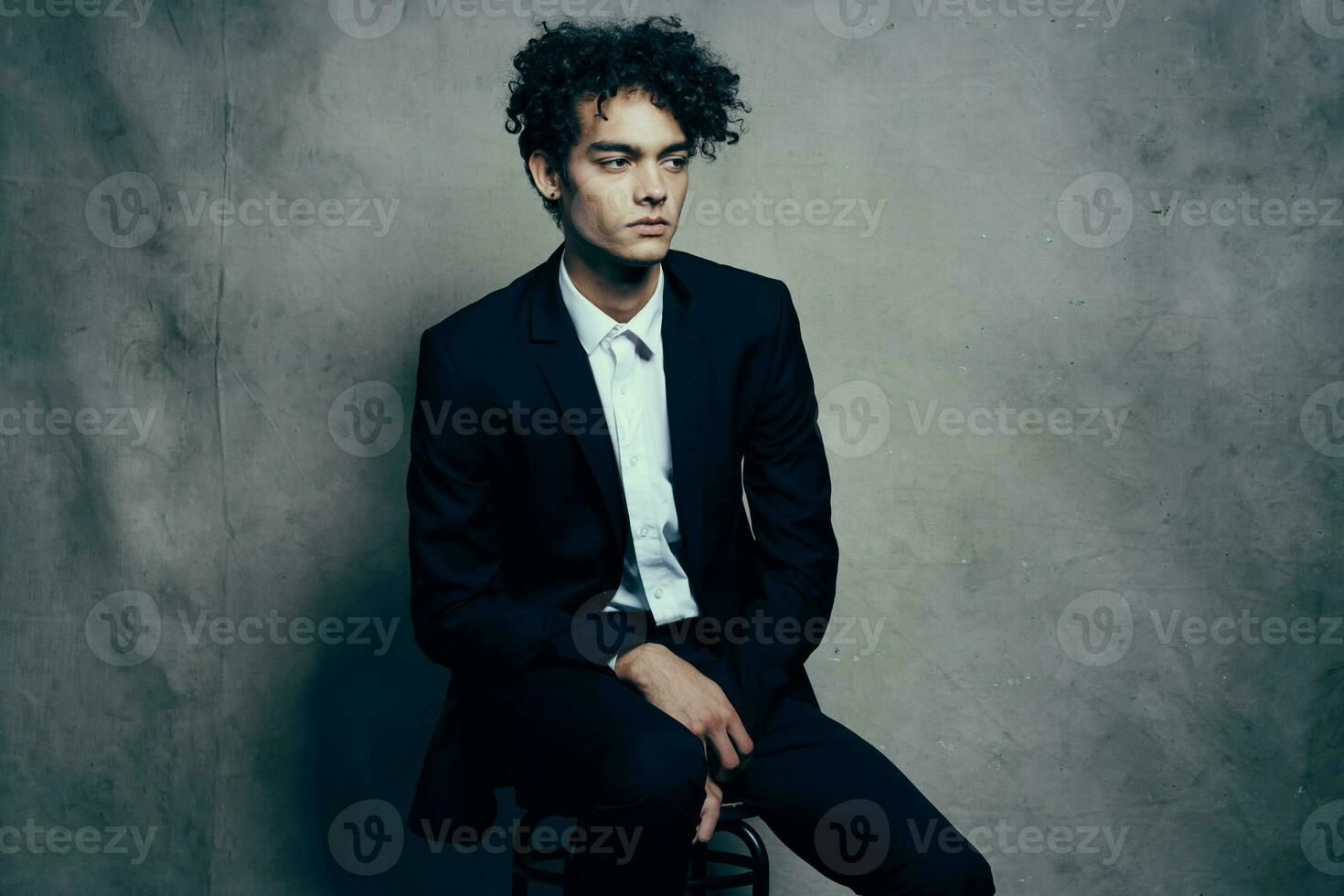business man in a suit sitting on a chair fashion modern style Professional photo