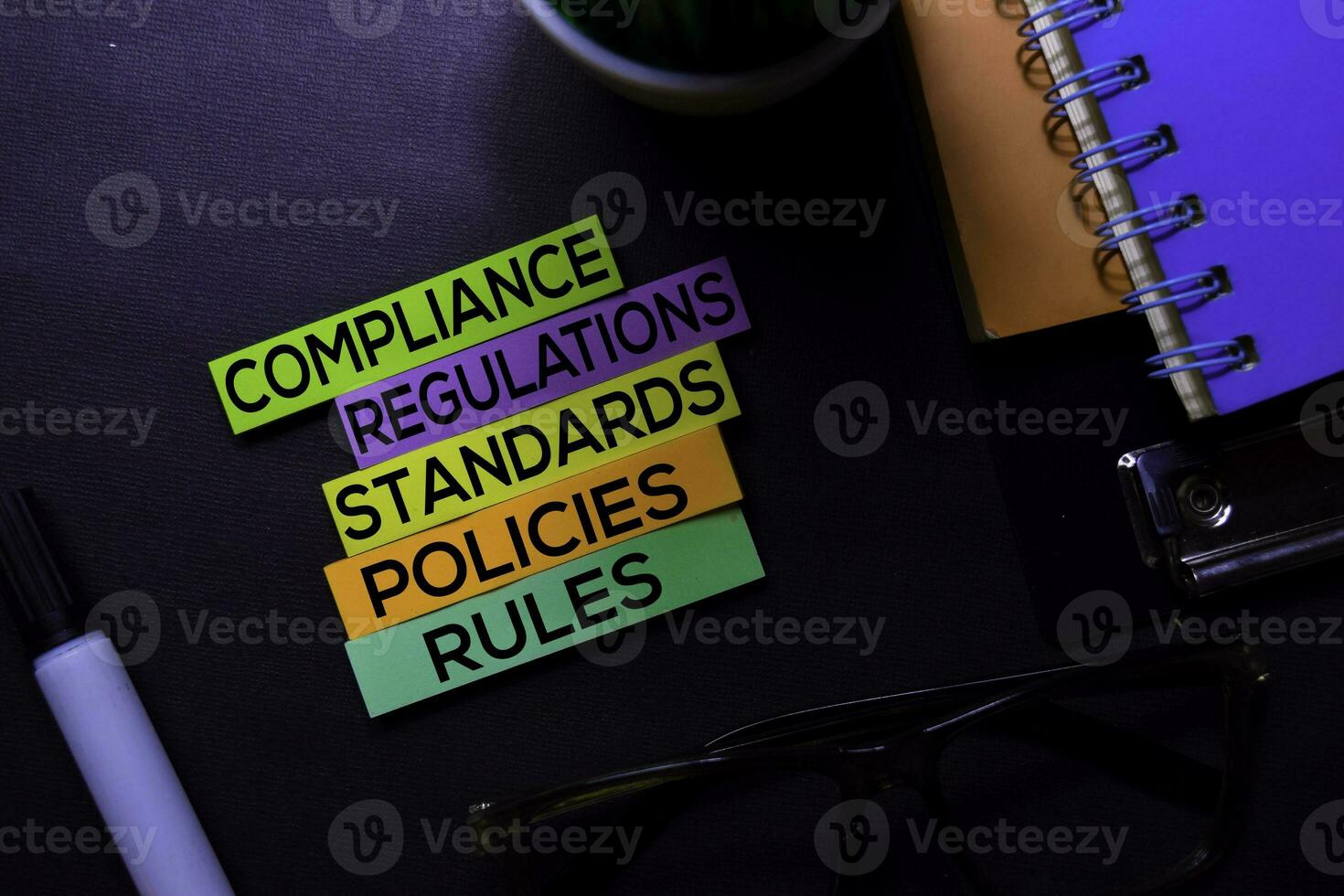 Compliance, Regulations, Strandards, Policies, Rules text on sticky notes isolated on Black desk. Mechanism Strategy Concept photo