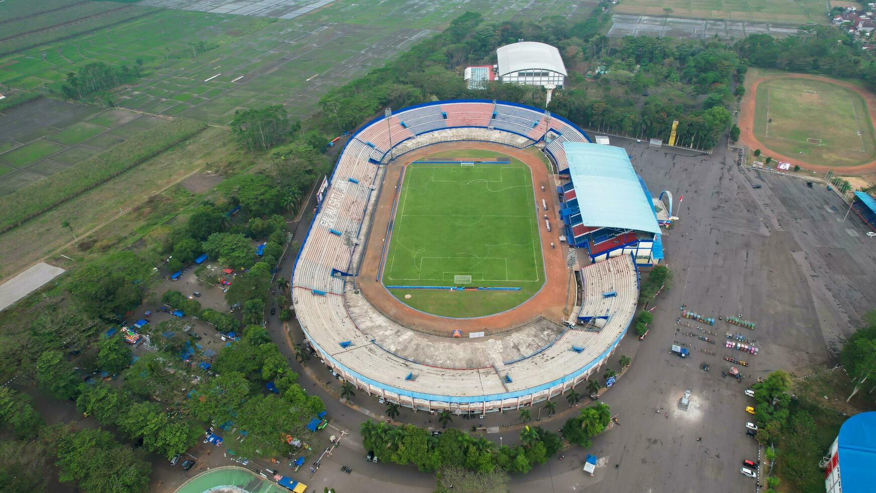 Aerial view of the Beautiful scenery of Kanjuruhan Stadium. with Malang cityscape background. Malang, Indonesia, August 26, 2022 photo
