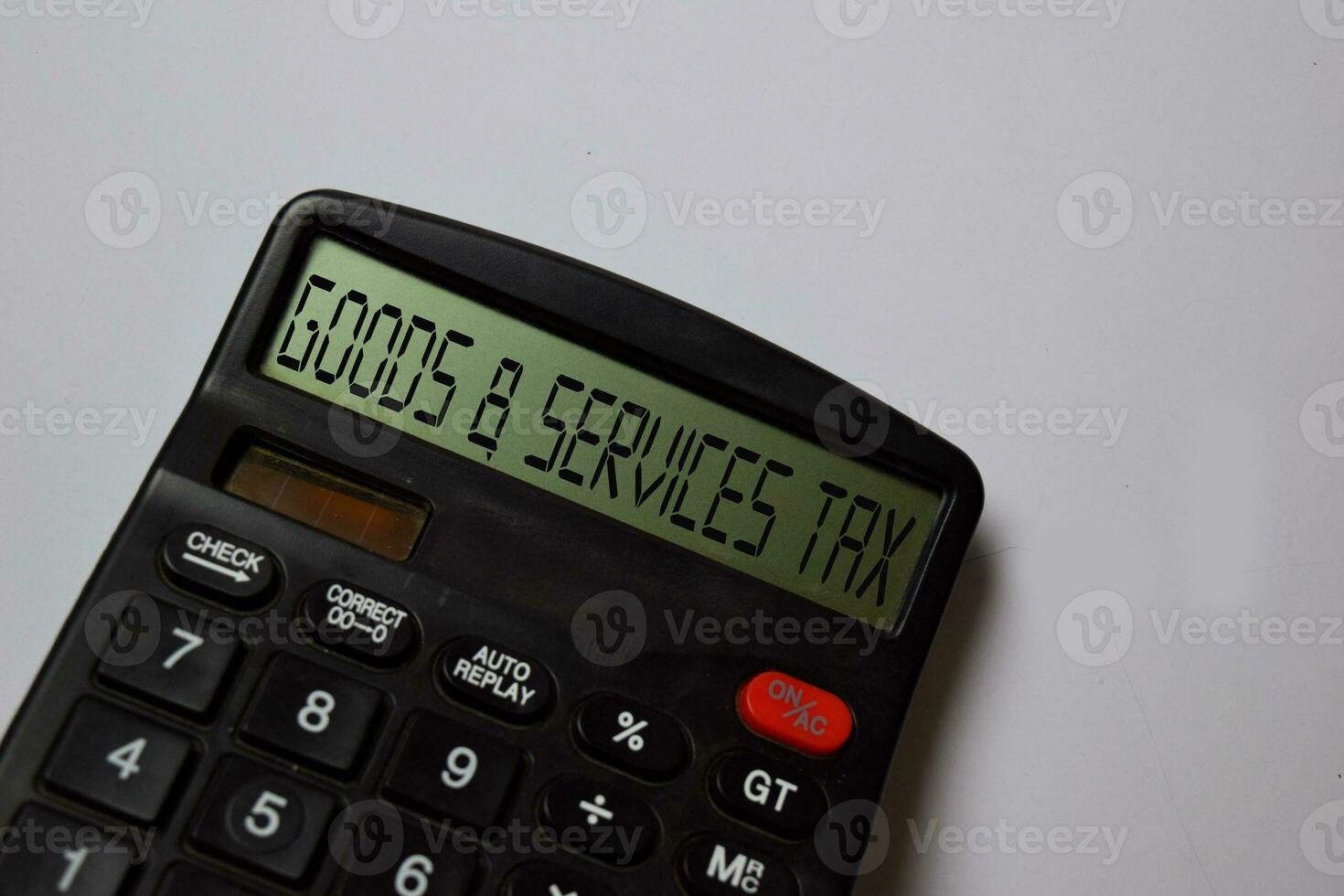 Goods and Services Tax write on calculator isolated on white board background. photo