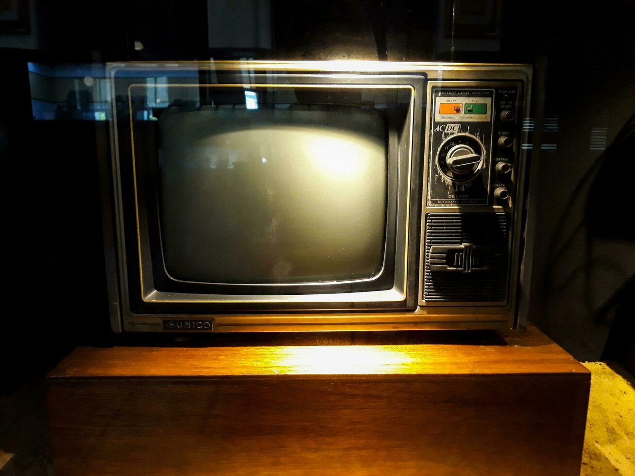 Old TV on old wood. Vintage old television. Still life in Museum Mandiri. JAKARTA, INDONESIA, APRIl 8, 2019 photo