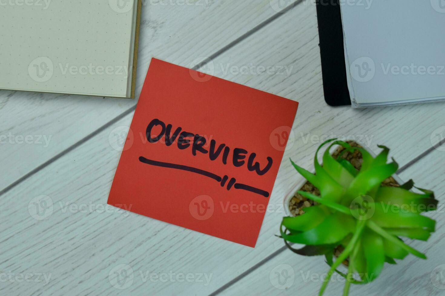 Overview write on sticky notes isolated on Wooden Table. photo