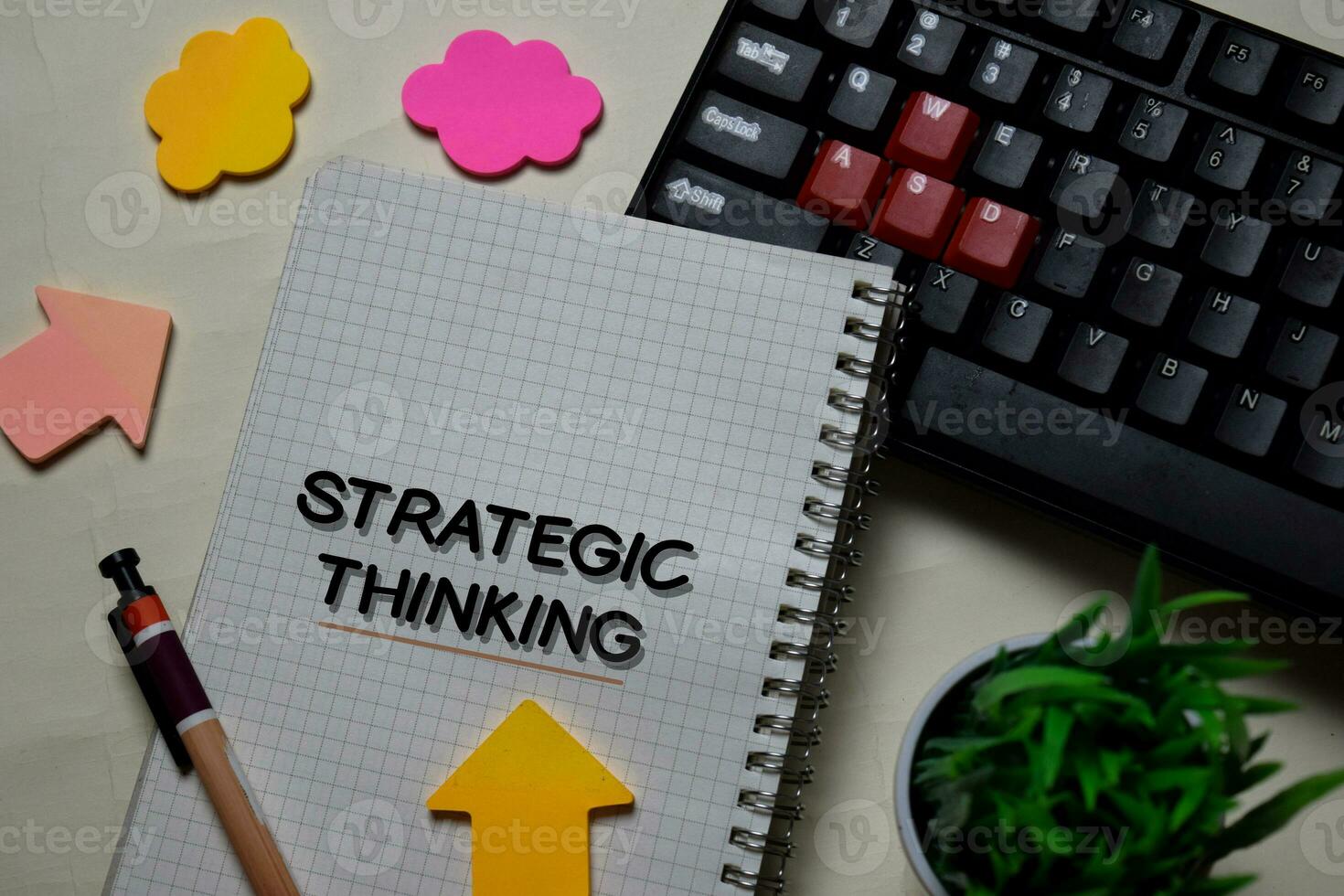 Strategic Thinking write on a book isolated on office desk. photo