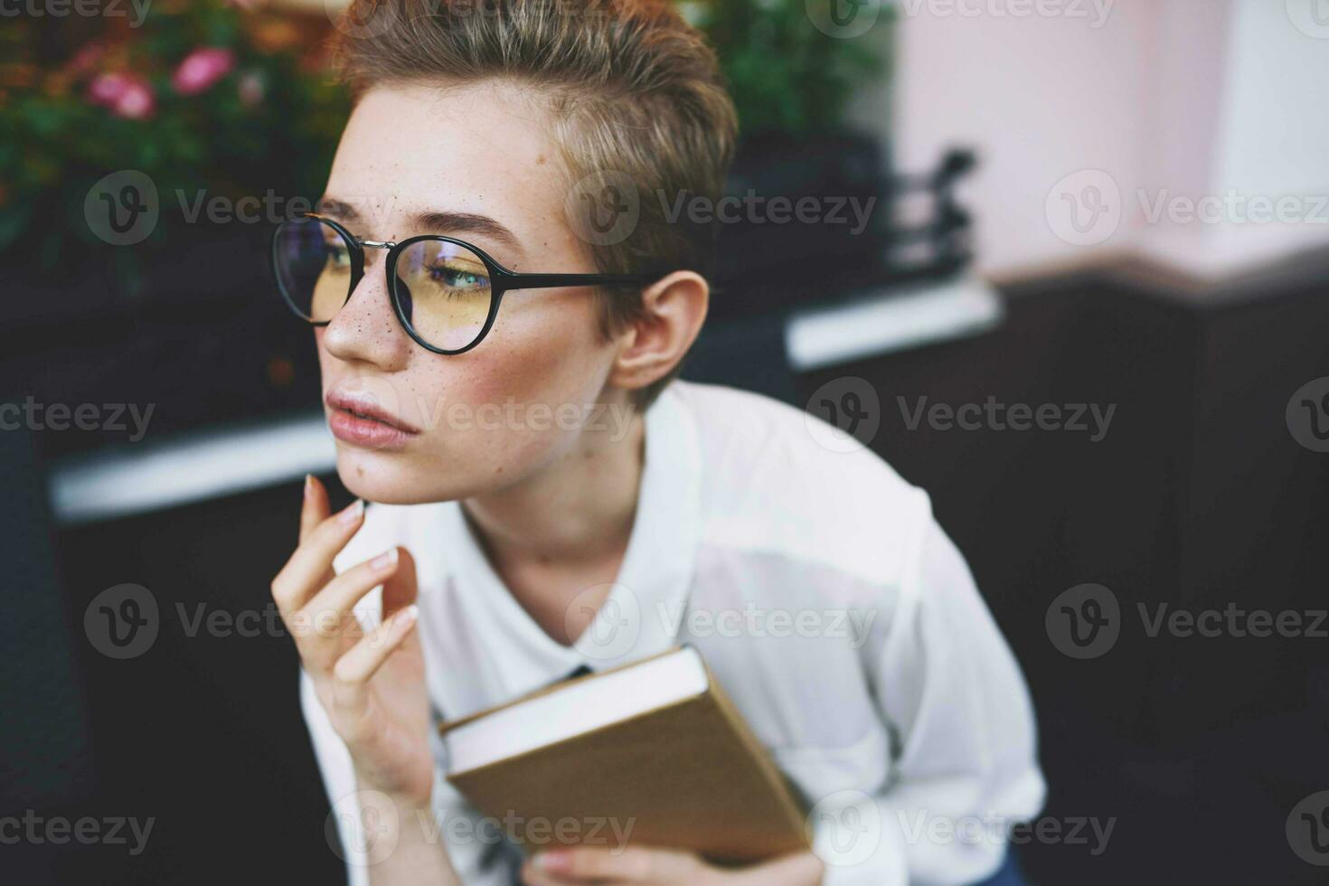 female on the street with a book in his hands education photo