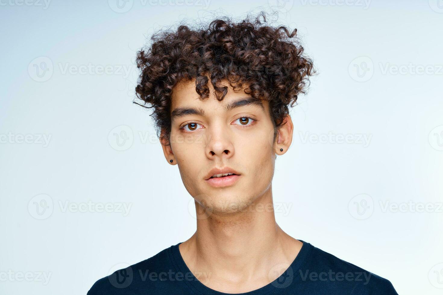 cute guy curly hair black t-shirt close-up model photo