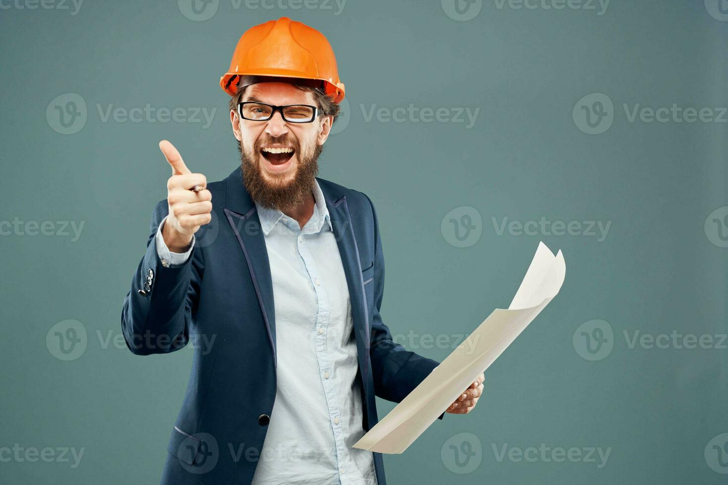 Emotional man in orange coloring drawings instruction manual construction work photo