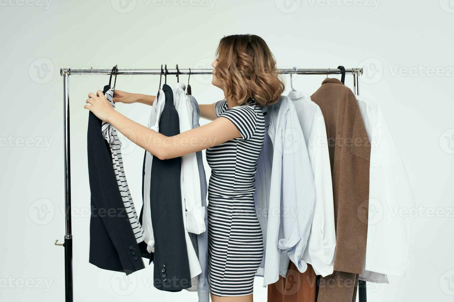 beautiful woman trying on clothes shop retail isolated background photo