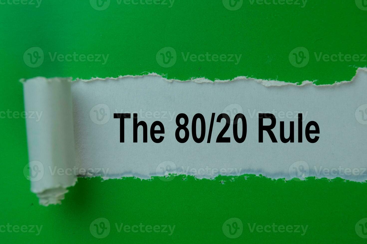 The 80 20 Rule Text written in torn paper. photo