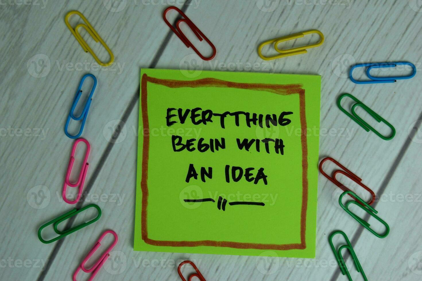 Everything Begin With An Idea write on sticky notes isolated on office desk. photo