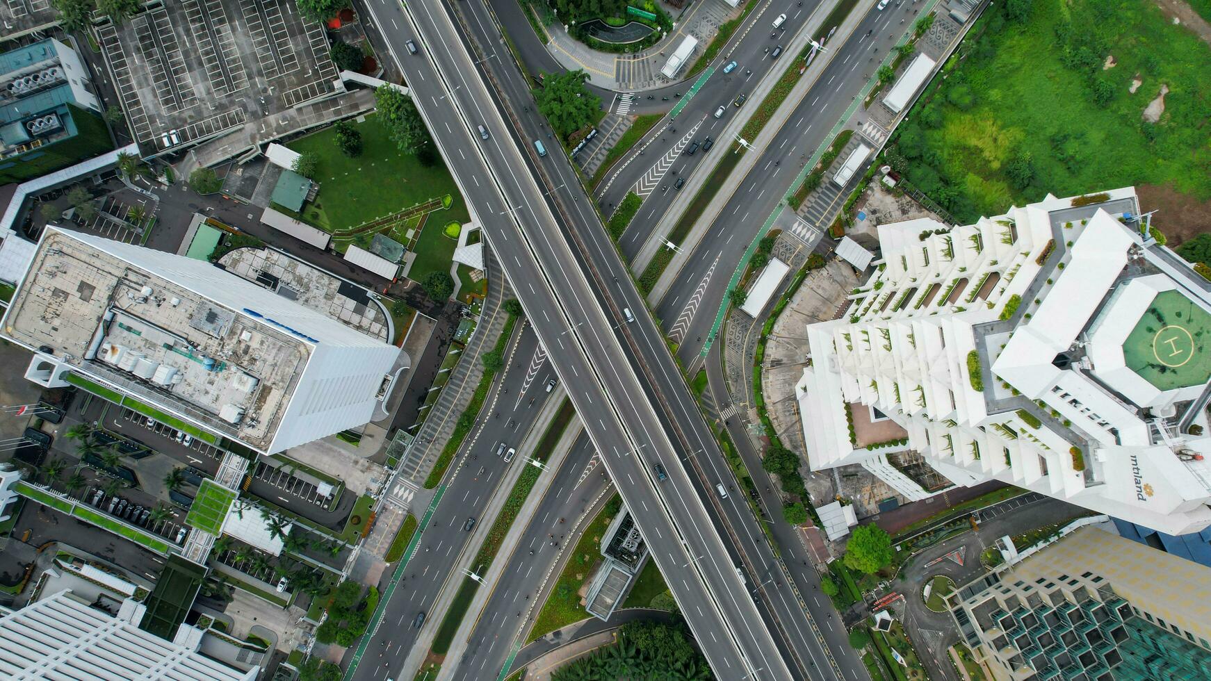 Aerial view of quiet traffic on Sudirman street with skyscrapers during weekend in Jakarta city. Jakarta, Indonesia, March 8, 2022 photo