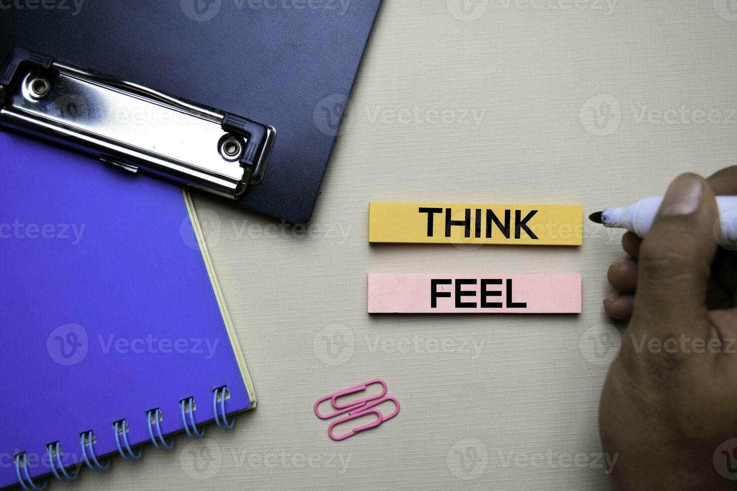 Think or Feel text on sticky notes with office desk concept 23668783
