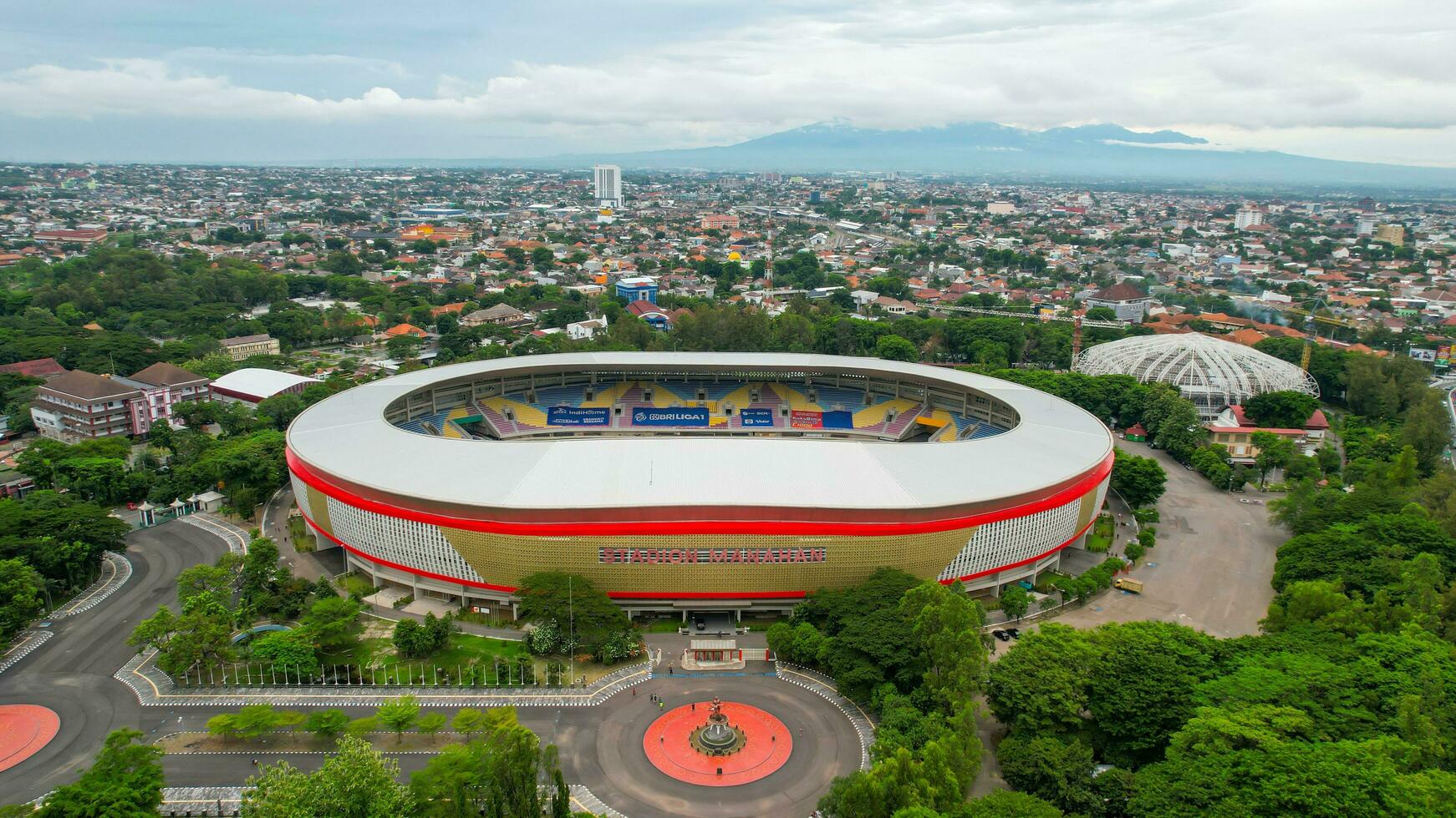 Aerial top down view of the Beautiful scenery of Manahan Solo Stadium. with cityscape background. Solo, Indonesia, December 6, 2021 photo