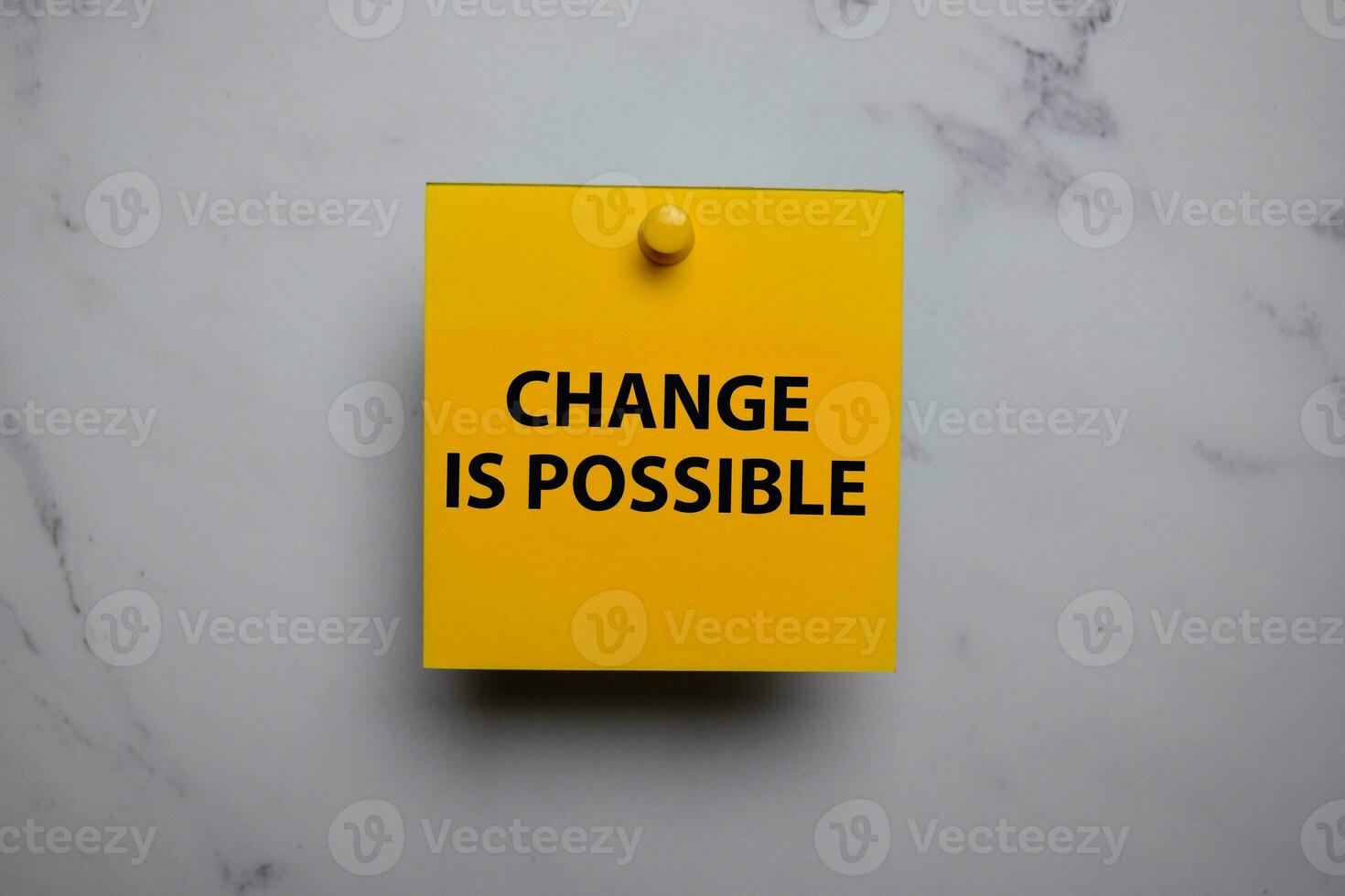 Change Is Possible write on sticky note isolated on Office Desk photo