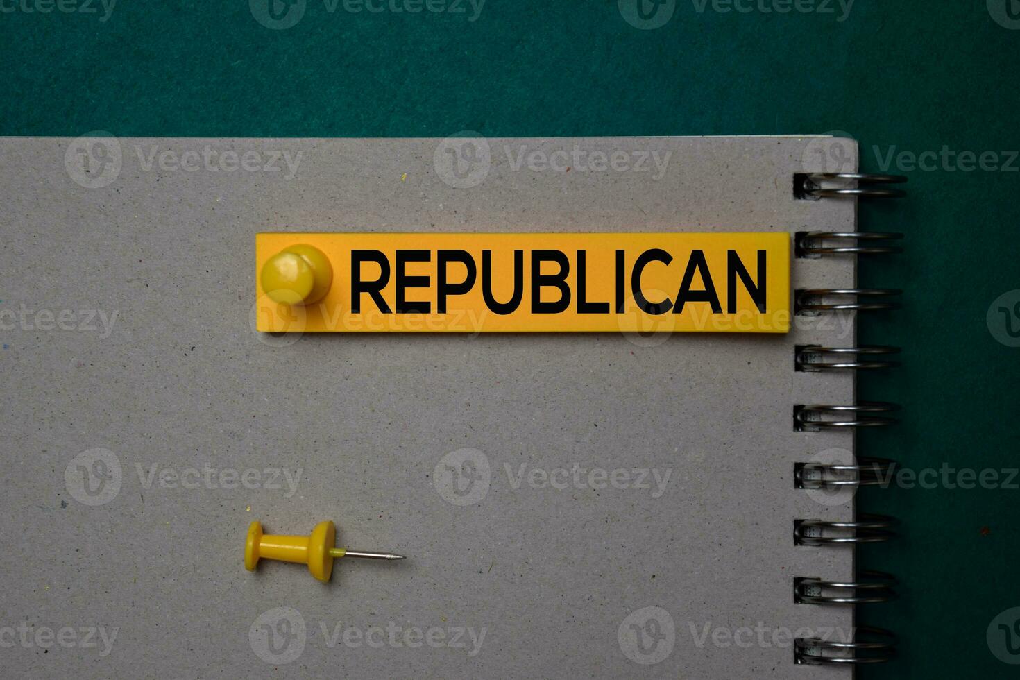 Republican write on a sticky note isolated on green background. photo