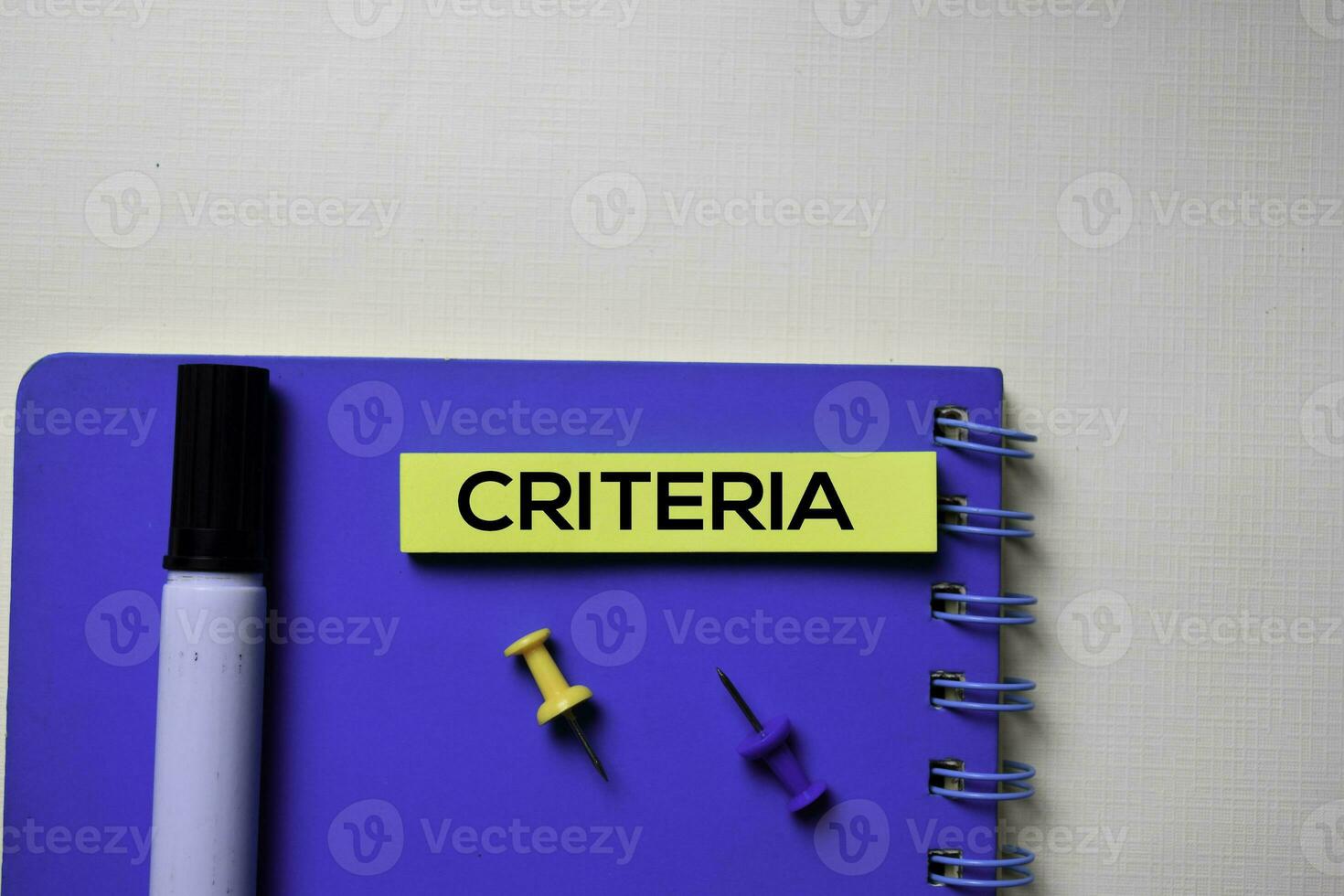 Criteria text on sticky notes isolated on office desk photo