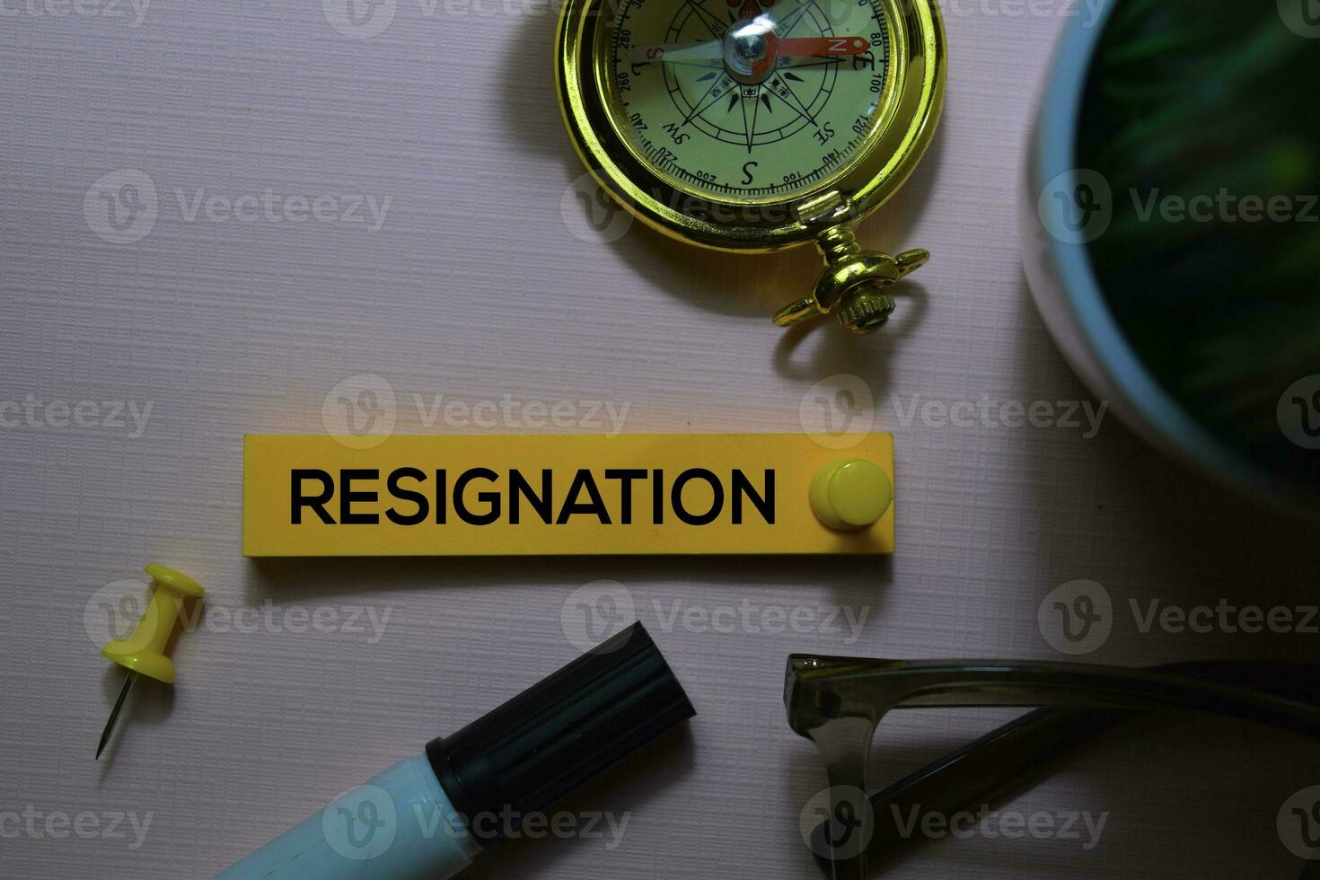 Resignation text on sticky notes isolated on office desk photo