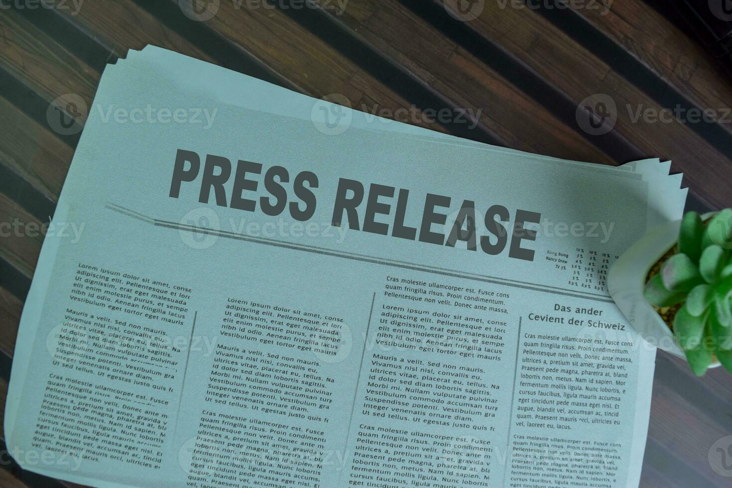 Press Release text in headline isolated on office desk. Newspaper concept photo