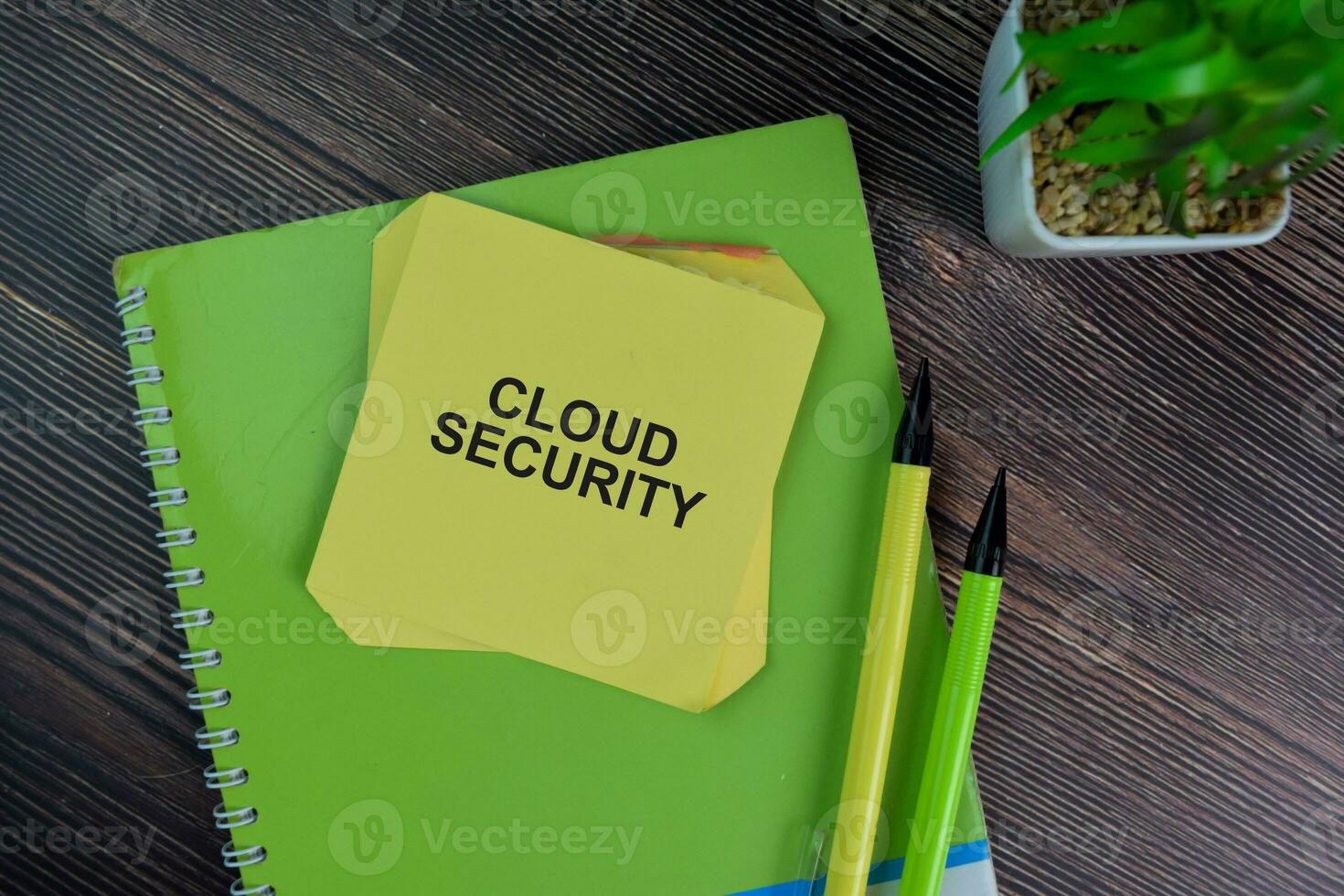 Cloud Security write on sticky notes isolated on Wooden Table. photo