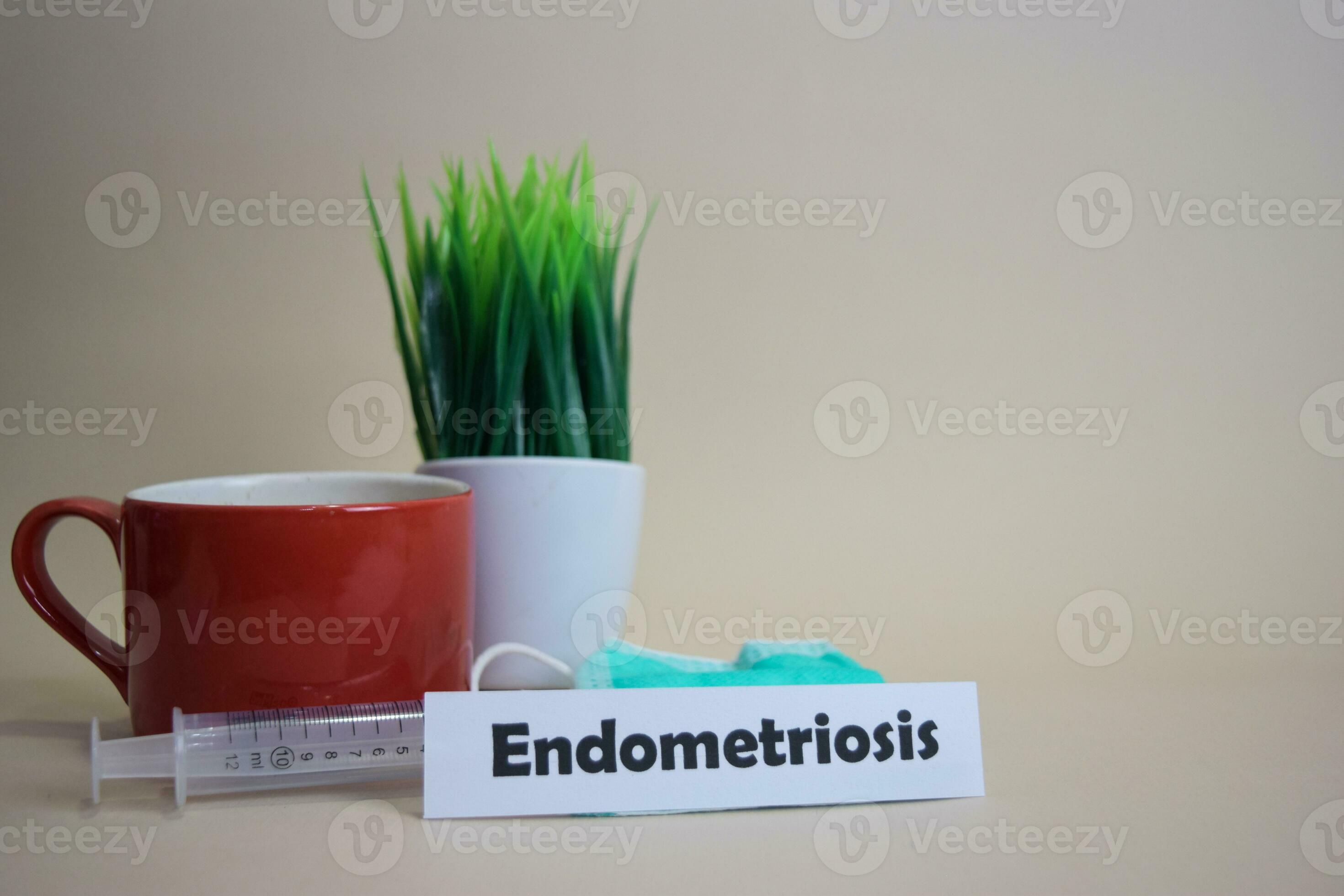 Endometriosis text, grass pot, coffee cup, syringe, and face green mask