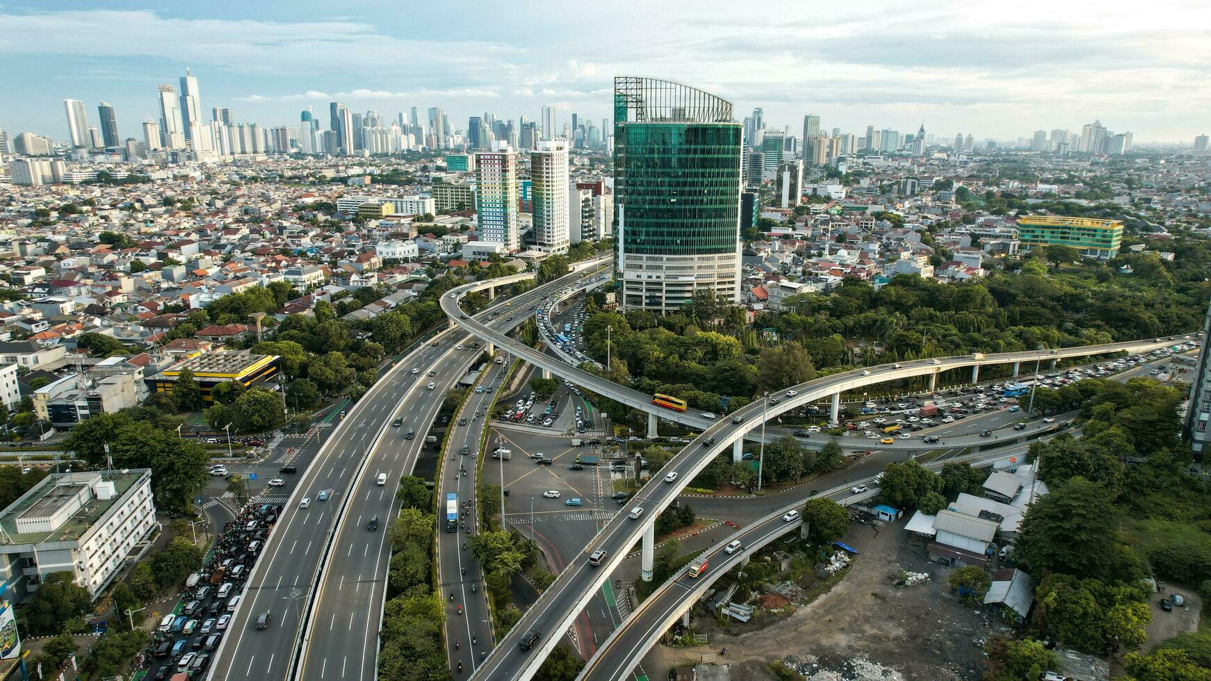 Aerial view of Taman Anggrek the biggest shopping mall and apartment in Jakarta when sunrise. Jakarta, Indonesia, November 28, 2022 photo