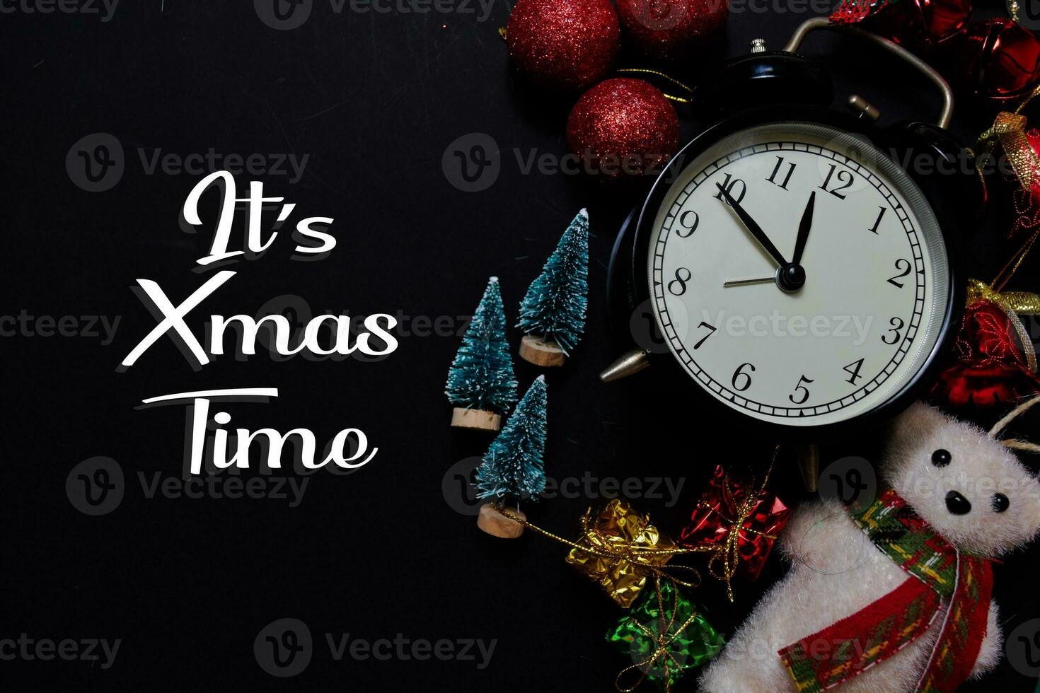 It's Xmas Time text isolated on black backgroud. Frame of Christmas Decoration. photo