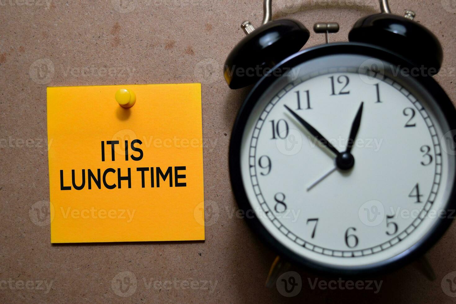 It Is Lunch Time write on Sticky note. Isolated on wooden table photo