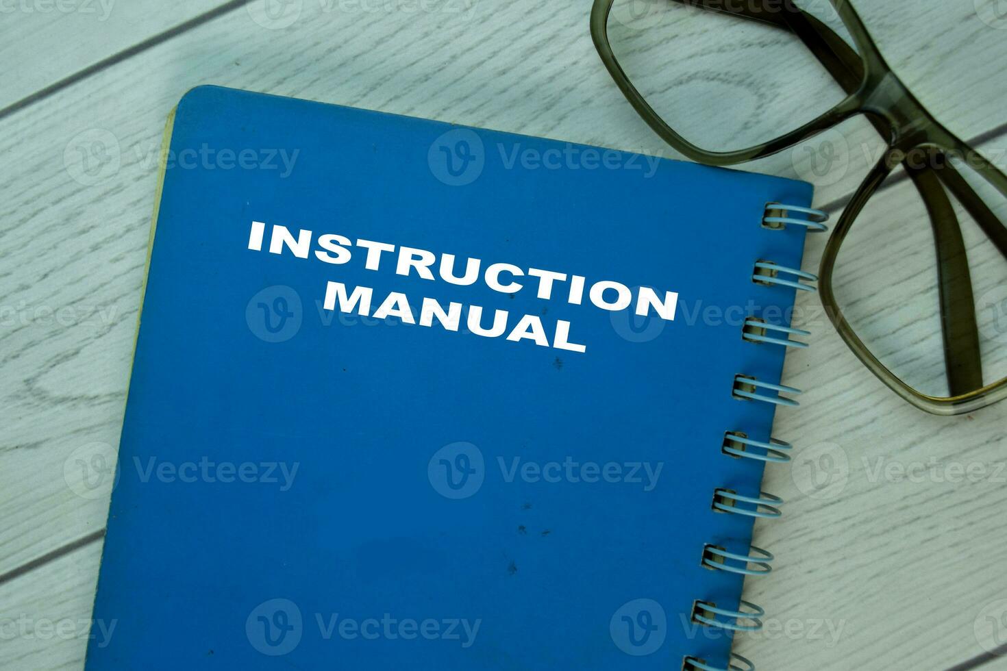 The Book of Instruction Manual on office desk. photo
