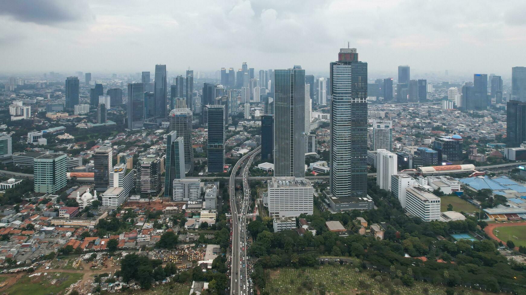 Aerial view of Asia Business concept for real estate - panoramic modern cityscape building bird eye aerial view and morning blue bright sky in Jakarta. Jakarta, Indonesia, December 24, 2022 photo