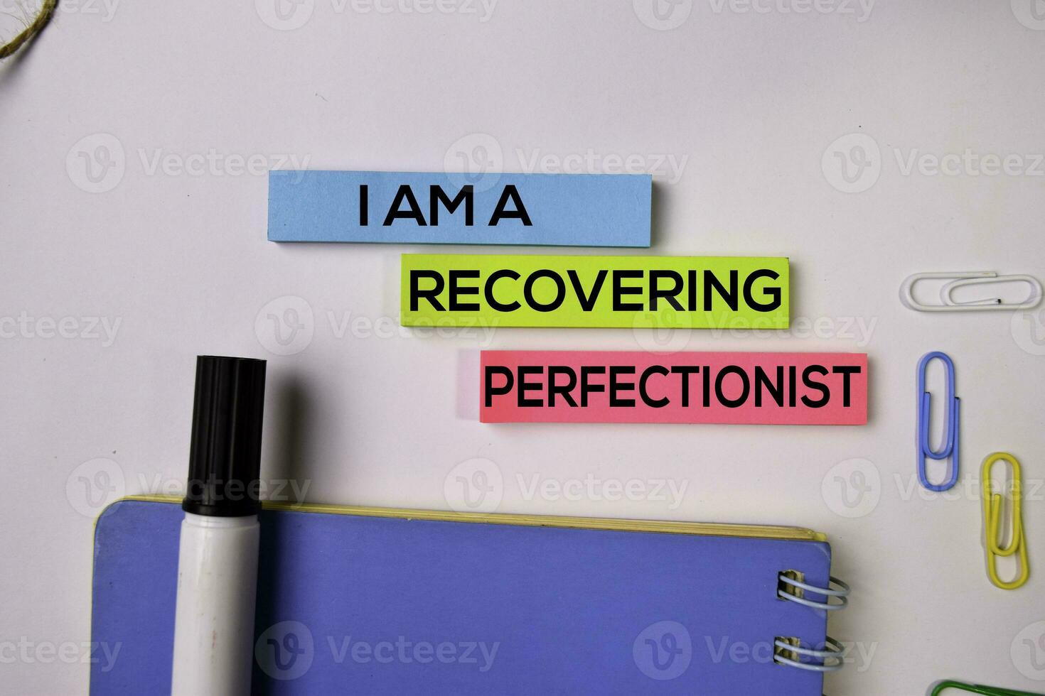 I am A Recovering Perfectionist on sticky notes isolated on white background. photo