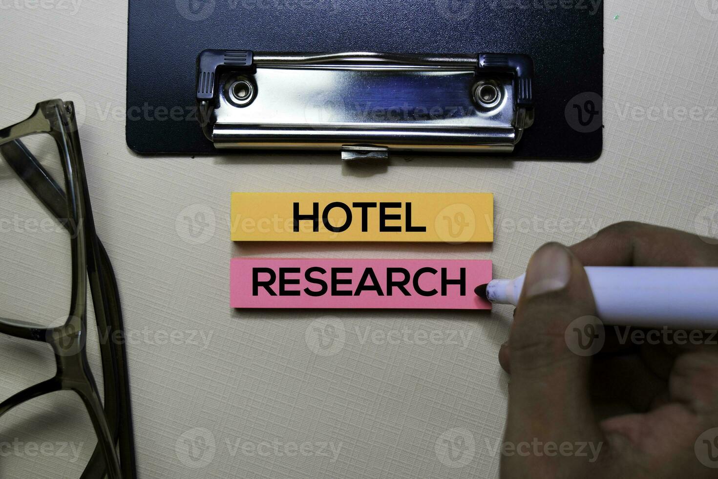 Hotel Research text on sticky notes isolated on office desk photo