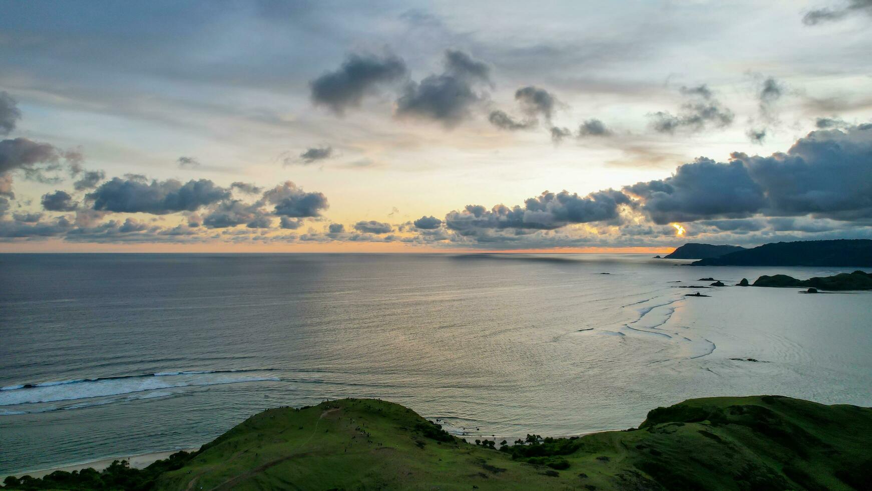 Aerial view of Selong Belanak, Tropical island with sandy beach and turquoise ocean with waves. Lombok. Indonesia, Mach 22, 2022 photo