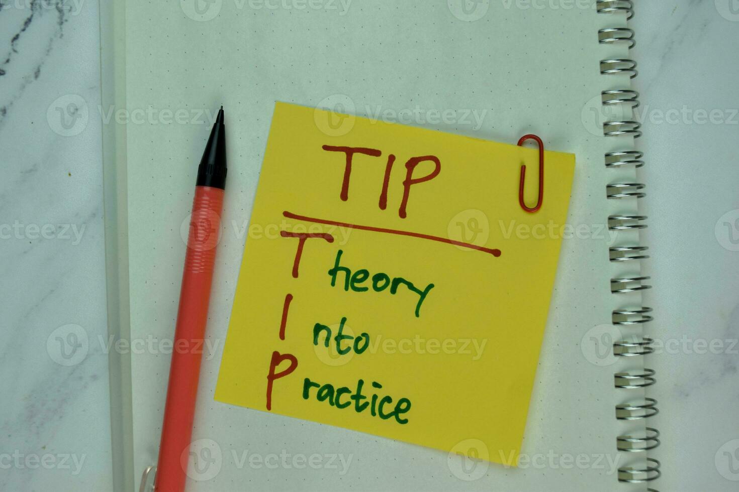 TIP - Theory Into Practice write on sticky note isolated on Wooden Table. photo