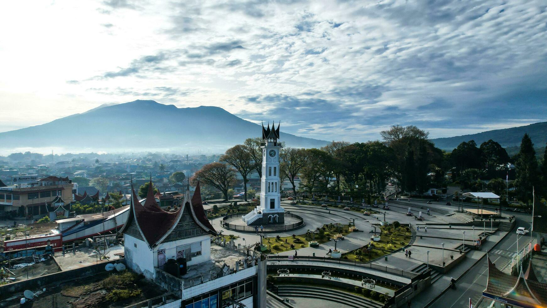 Aerial view of Jam Gadang, a historical and most famous landmark in BukitTinggi City, an icon of the city and the most visited tourist destination by tourists. Bukittinggi, Indonesia, January 25, 2023 photo