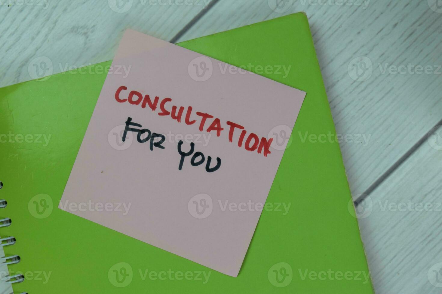 Concept of Consultation For You write on a book isolated on Wooden Table. photo