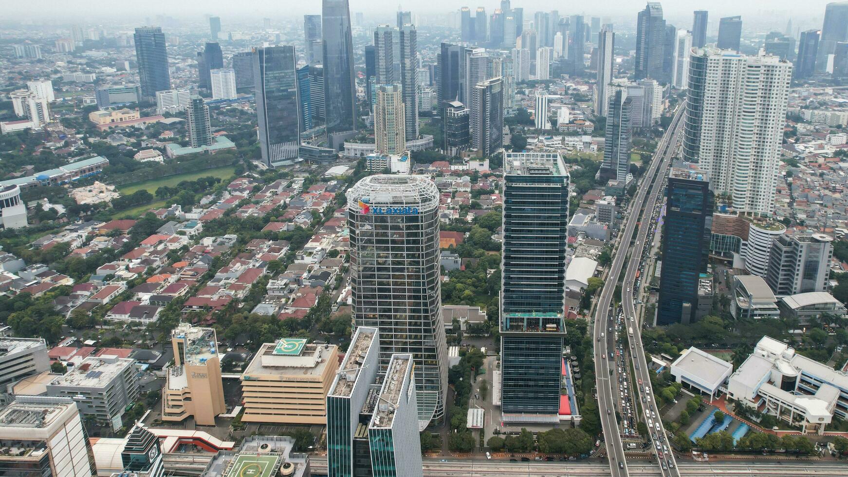 Aerial view of Asia Business concept for real estate - panoramic modern cityscape building bird eye aerial view and morning blue bright sky in Jakarta. Jakarta, Indonesia, December 24, 2022 photo